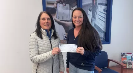 AAACU Team members taking a selfie as they clean up trash in their community
